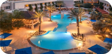 Aerial view of the pools at The Scottsdale Resort & Spa in the evening.